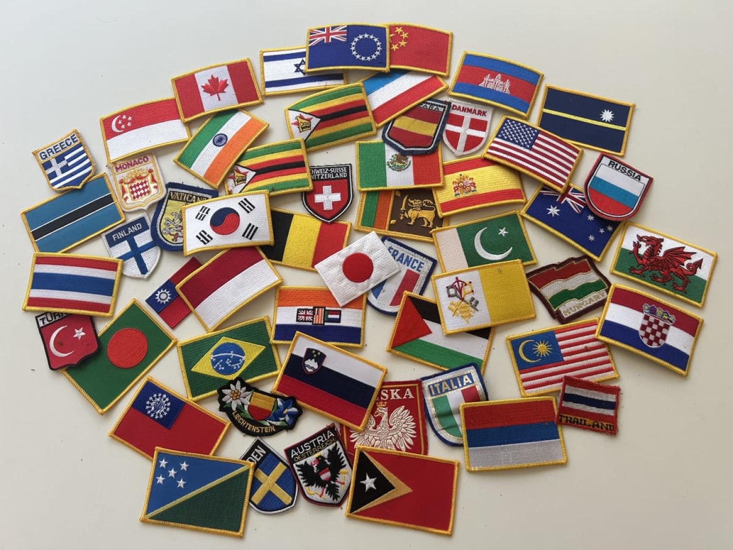 Maybe I hoped to take up sewing? A flag patch for most of the countries the beloved and I have visited, along with a few contested territories, too. I found them stuffed in an envelope, forgotten.