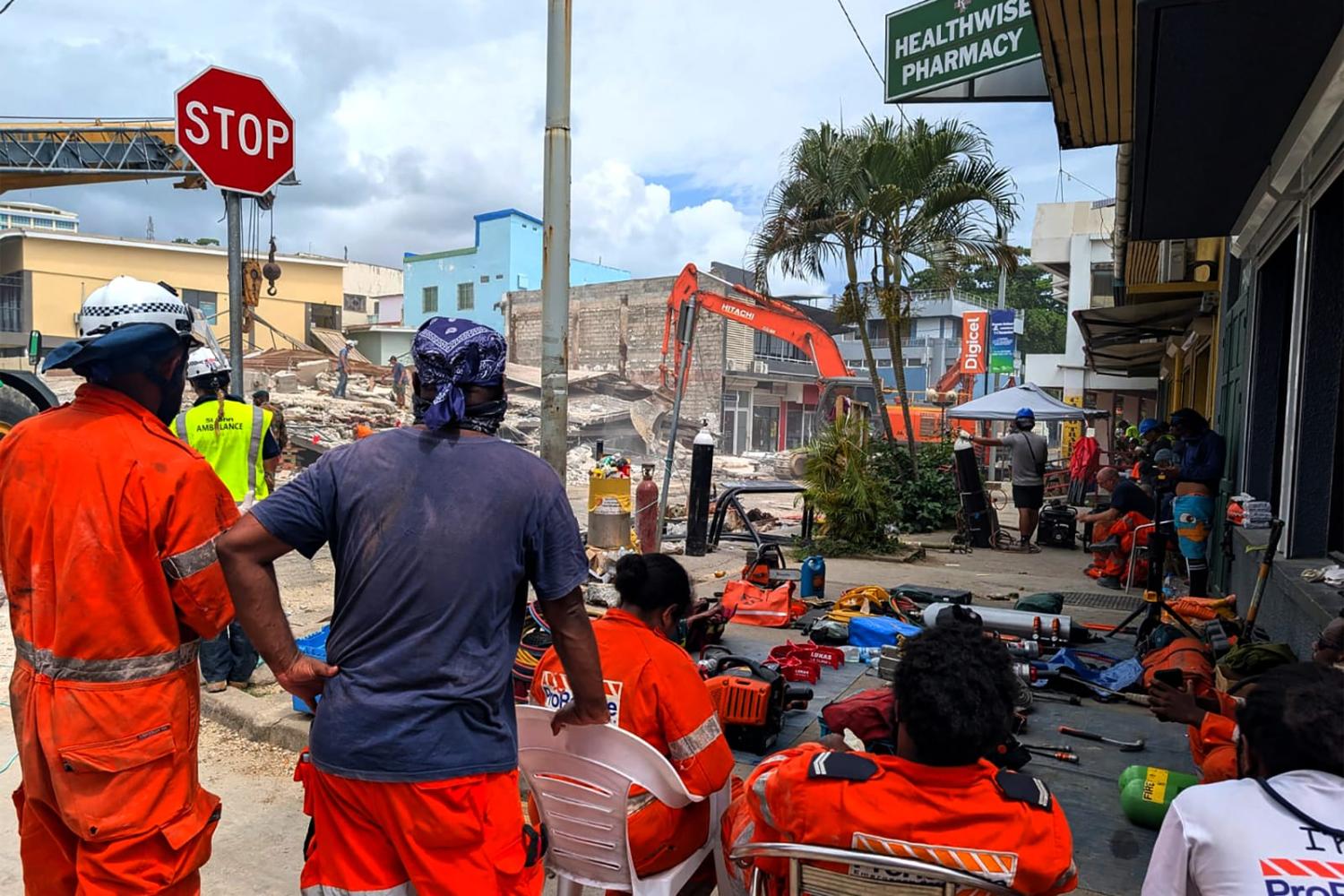 Rescue workers at a collapsed building after an earthquake struck Port Vila, the capital city of Vanuatu, on 18 December 2024 (AFP via Getty Images)