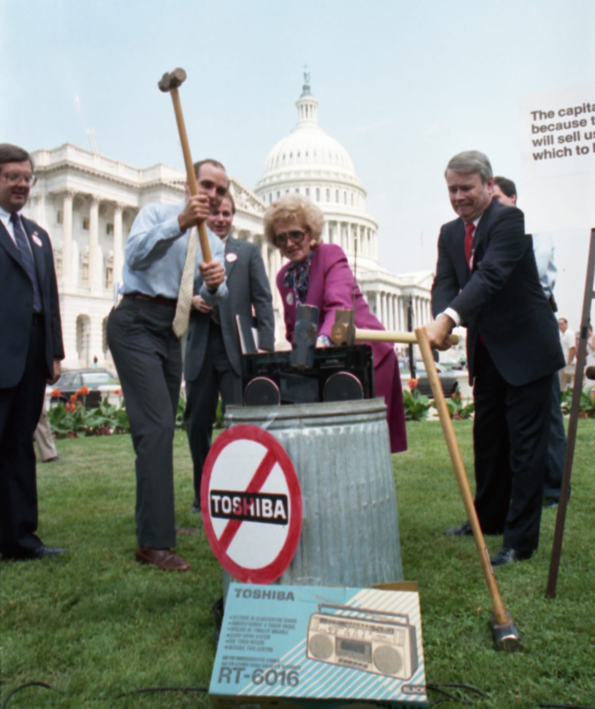 A group of Republican congress members smash a Japanese made Toshiba radio on the lawns of the US Capitol in 1987 (Bettmann/Getty Images)