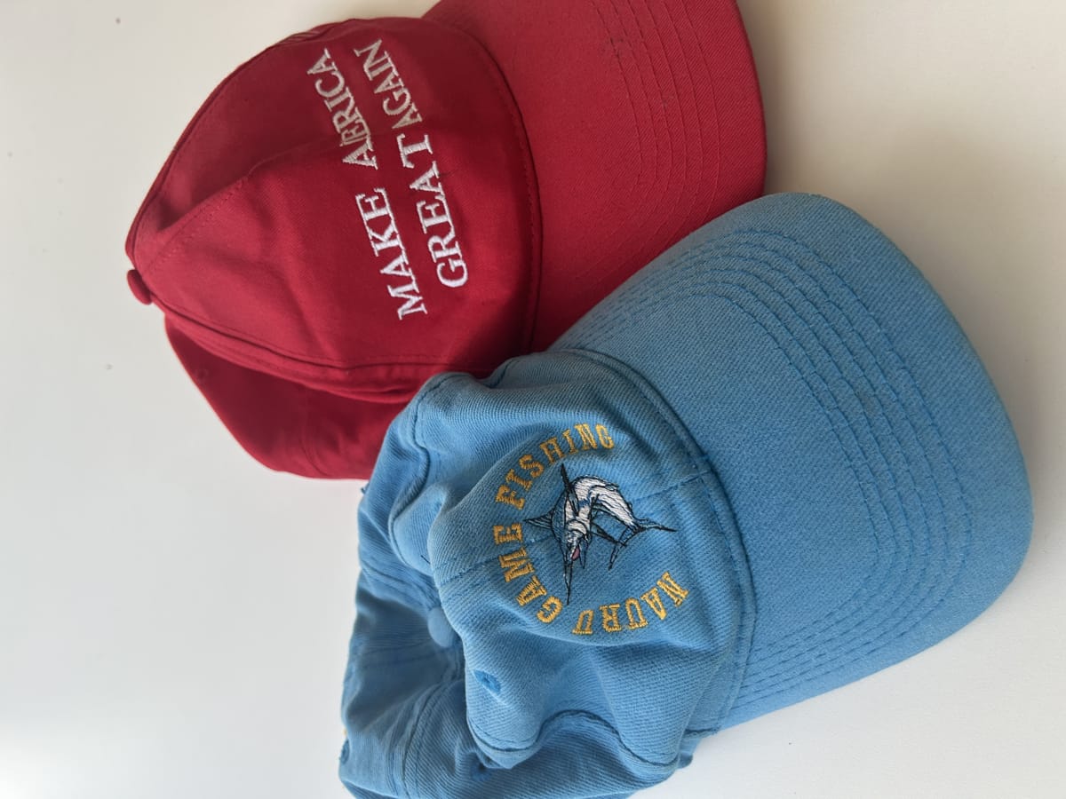 Two hats, Nauru Game Fishing and a Make America Great Again